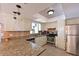 Well-appointed kitchen featuring granite countertops, stainless steel appliances, and ample cabinet space at 3417 49Th W St, Bradenton, FL 34209