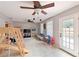 Bright, neutral-toned living room featuring two ceiling fans and natural light from windows at 3417 49Th W St, Bradenton, FL 34209