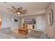 Cozy living room with a large sectional sofa, unique ceiling fan, and a mounted flat-screen TV at 3417 49Th W St, Bradenton, FL 34209