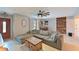Inviting living room boasts a large sectional sofa, rustic wood accents, and stylish decor at 3417 49Th W St, Bradenton, FL 34209