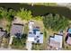 An aerial view of the home, revealing its pool and the adjacent canal with mature landscape at 3585 Brooklyn Ave, Port Charlotte, FL 33952