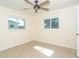 A light and airy bedroom featuring two windows at 3585 Brooklyn Ave, Port Charlotte, FL 33952