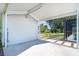 View from carport shows the backyard and patio area at 3585 Brooklyn Ave, Port Charlotte, FL 33952