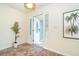 Bright entryway featuring tile flooring and a decorative glass door leading to a naturally-lit front porch at 3585 Brooklyn Ave, Port Charlotte, FL 33952