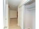 Inviting hallway featuring neutral tile, a closet, and access to other rooms at 3585 Brooklyn Ave, Port Charlotte, FL 33952