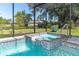 Enclosed jacuzzi in the pool area that has a view of the yard at 3585 Brooklyn Ave, Port Charlotte, FL 33952