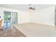 Bright living room with tile flooring and sliding glass doors at 3585 Brooklyn Ave, Port Charlotte, FL 33952