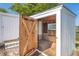 Exterior shot of a shed featuring a wood door, window, and corrugated metal siding at 3585 Brooklyn Ave, Port Charlotte, FL 33952