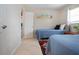 Bedroom featuring two twin beds with closet and tile flooring at 3745 Almeria Ave # 7S, Sarasota, FL 34239