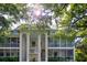 Charming two-story condo building featuring screened in patios and mature trees, creating a serene outdoor space at 3745 Almeria Ave # 7S, Sarasota, FL 34239