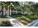 Condo building featuring lush landscaping and charming screened-in patios at 3745 Almeria Ave # 7S, Sarasota, FL 34239