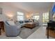 Cozy living area with a couch, chairs, and a rug, creating a relaxing atmosphere at 3745 Almeria Ave # 7S, Sarasota, FL 34239