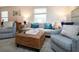 Bright living room featuring comfortable seating, stylish decor, and lots of natural light at 3745 Almeria Ave # 7S, Sarasota, FL 34239