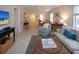 Inviting living room featuring neutral walls, tile floors, comfortable seating, and view into the dining area at 3745 Almeria Ave # 7S, Sarasota, FL 34239
