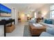 Bright living room with stylish furnishings, a ceiling fan, and a view into the dining area at 3745 Almeria Ave # 7S, Sarasota, FL 34239