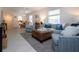 Inviting living room with stylish furniture and open dining area at 3745 Almeria Ave # 7S, Sarasota, FL 34239