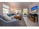 Bright living room with modern decor, tile flooring, and a welcoming atmosphere at 3745 Almeria Ave # 7S, Sarasota, FL 34239