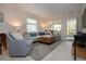 Cozy living area with a couch, chairs, and a rug, creating a relaxing atmosphere at 3745 Almeria Ave # 7S, Sarasota, FL 34239