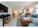 Bright living room with stylish furnishings, a ceiling fan, and a view into the dining area at 3745 Almeria Ave # 7S, Sarasota, FL 34239
