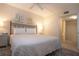 Bright and inviting bedroom featuring art decorations, closet and a comfortable bed at 3745 Almeria Ave # 7S, Sarasota, FL 34239