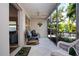 Relaxing screened patio with comfortable seating and lovely outdoor view at 3745 Almeria Ave # 7S, Sarasota, FL 34239