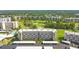Scenic aerial view of the condo complex, showcasing the meticulously landscaped grounds and golf course at 3820 Ironwood Ln # 104-I, Bradenton, FL 34209