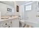 All-white bathroom featuring a bathtub, shower, toilet, vanity and sink at 3820 Ironwood Ln # 104-I, Bradenton, FL 34209