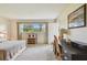 Bright bedroom with natural light, a workspace, and neutral tones for a serene atmosphere at 3820 Ironwood Ln # 104-I, Bradenton, FL 34209