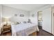Bright bedroom with beach decor, hardwood floors, and door to closet at 3820 Ironwood Ln # 104-I, Bradenton, FL 34209