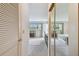 Comfortable bedroom featuring mirrored closet doors and a view to the outside at 3820 Ironwood Ln # 104-I, Bradenton, FL 34209