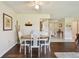 The dining area features an oval table with seating for four and classic decor at 3820 Ironwood Ln # 104-I, Bradenton, FL 34209