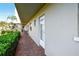 Exterior view of condo showing the front entry with red brick path at 3820 Ironwood Ln # 104-I, Bradenton, FL 34209