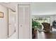 Bright hallway with bi-fold doors and wood floors leads to an inviting living space with an expansive view at 3820 Ironwood Ln # 104-I, Bradenton, FL 34209