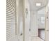 Hallway with tiled and hardwood floors, closet, and access to additional rooms at 3820 Ironwood Ln # 104-I, Bradenton, FL 34209
