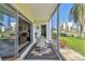 Glass enclosed lanai with an open view of the lush lawn, perfect for relaxing or entertaining at 3820 Ironwood Ln # 104-I, Bradenton, FL 34209