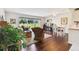 Open living area with hardwood floors and inviting view of the outdoor area at 3820 Ironwood Ln # 104-I, Bradenton, FL 34209