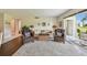 Bright and spacious living room with plush seating, hardwood floors and a large window view at 3820 Ironwood Ln # 104-I, Bradenton, FL 34209