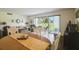 Bright open floor plan with tile floors, comfortable seating, and sliding glass doors that bring the outside in at 3820 Ironwood Ln # 104-I, Bradenton, FL 34209