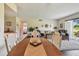 Inviting open floor plan with an expansive living room and dining area, complete with hardwood floors at 3820 Ironwood Ln # 104-I, Bradenton, FL 34209
