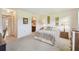 Main bedroom with artwork and soothing colors, plus an ensuite bathroom for convenience and privacy at 3820 Ironwood Ln # 104-I, Bradenton, FL 34209