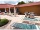 Outdoor patio with outdoor tables and chairs; several BBQ grills are available at 3820 Ironwood Ln # 104-I, Bradenton, FL 34209