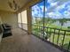 Enjoy the outdoors from this screened in balcony with a water view and seating area at 3917 Lake Bayshore Dr # F-307, Bradenton, FL 34205