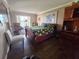 Bright bedroom with hardwood floors, lake view, and decorative seating at 3917 Lake Bayshore Dr # F-307, Bradenton, FL 34205