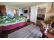Comfortable bedroom featuring hardwood floors, closet, and adjacent bathroom and living room at 3917 Lake Bayshore Dr # F-307, Bradenton, FL 34205