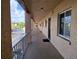 Exterior hallway of the building showcasing covered walkways and access to the unit at 3917 Lake Bayshore Dr # F-307, Bradenton, FL 34205