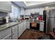 Well-lit kitchen with stainless steel appliances, marble countertops, and a stylish backsplash at 3917 Lake Bayshore Dr # F-307, Bradenton, FL 34205