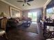 Living room area with hardwood floors, comfortable seating, and natural light at 3917 Lake Bayshore Dr # F-307, Bradenton, FL 34205