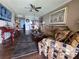 Comfortable living space featuring hardwood floors, cozy seating, and an open layout to dining area at 3917 Lake Bayshore Dr # F-307, Bradenton, FL 34205
