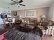 Inviting living space flows into dining, creating an open and airy atmosphere with hardwood floors at 3917 Lake Bayshore Dr # F-307, Bradenton, FL 34205