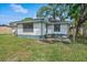 Exterior elevation view of home and yard at 400 E Baffin Dr, Venice, FL 34293